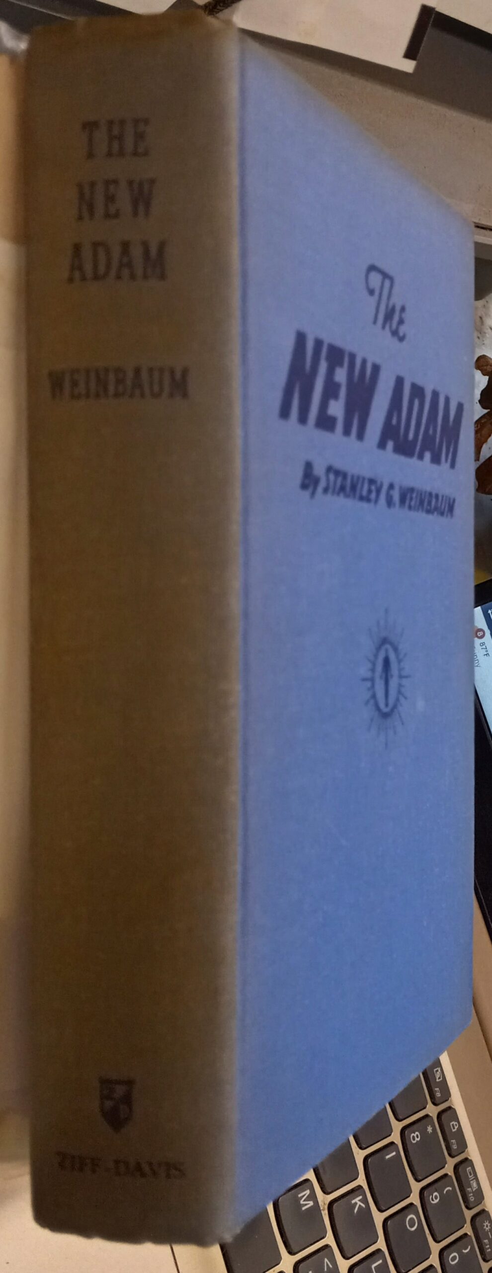The New Adam binding spine and front board
