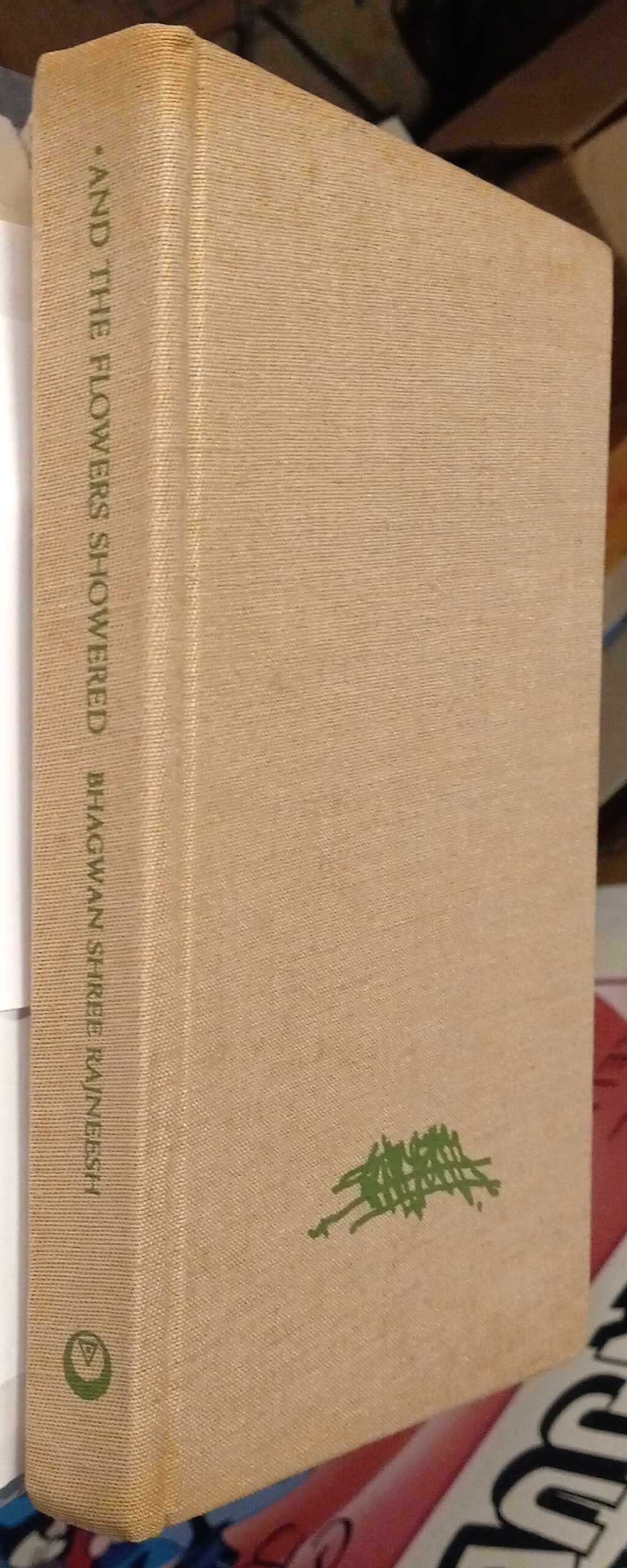 And the Flowers Showered binding spine and front board