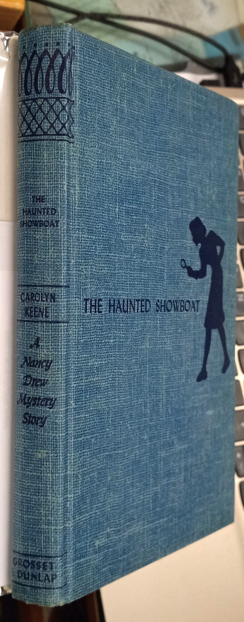 The Haunted Showboat binding spine and front board