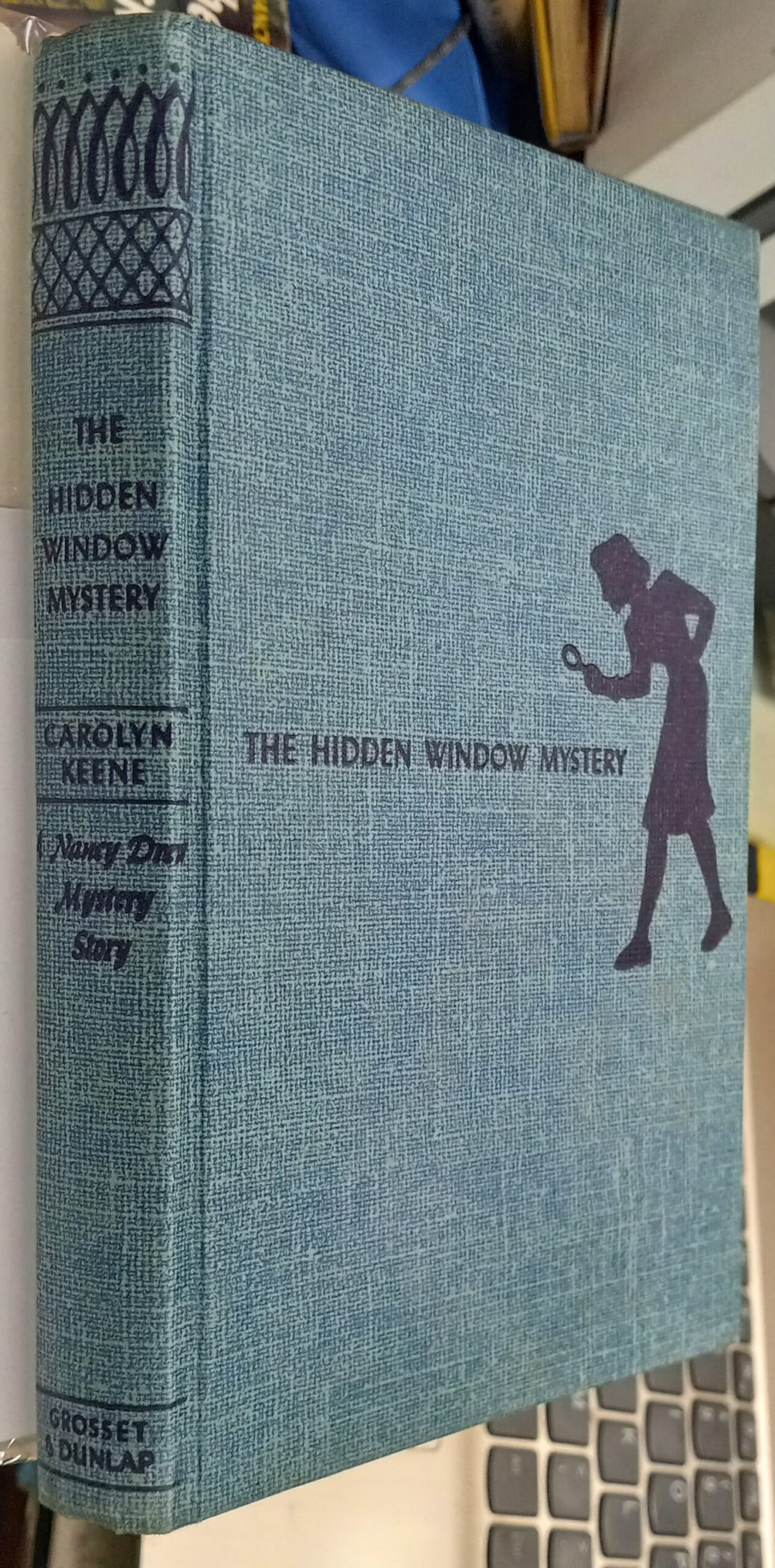 The Hidden Window Mystery binding spine and front board