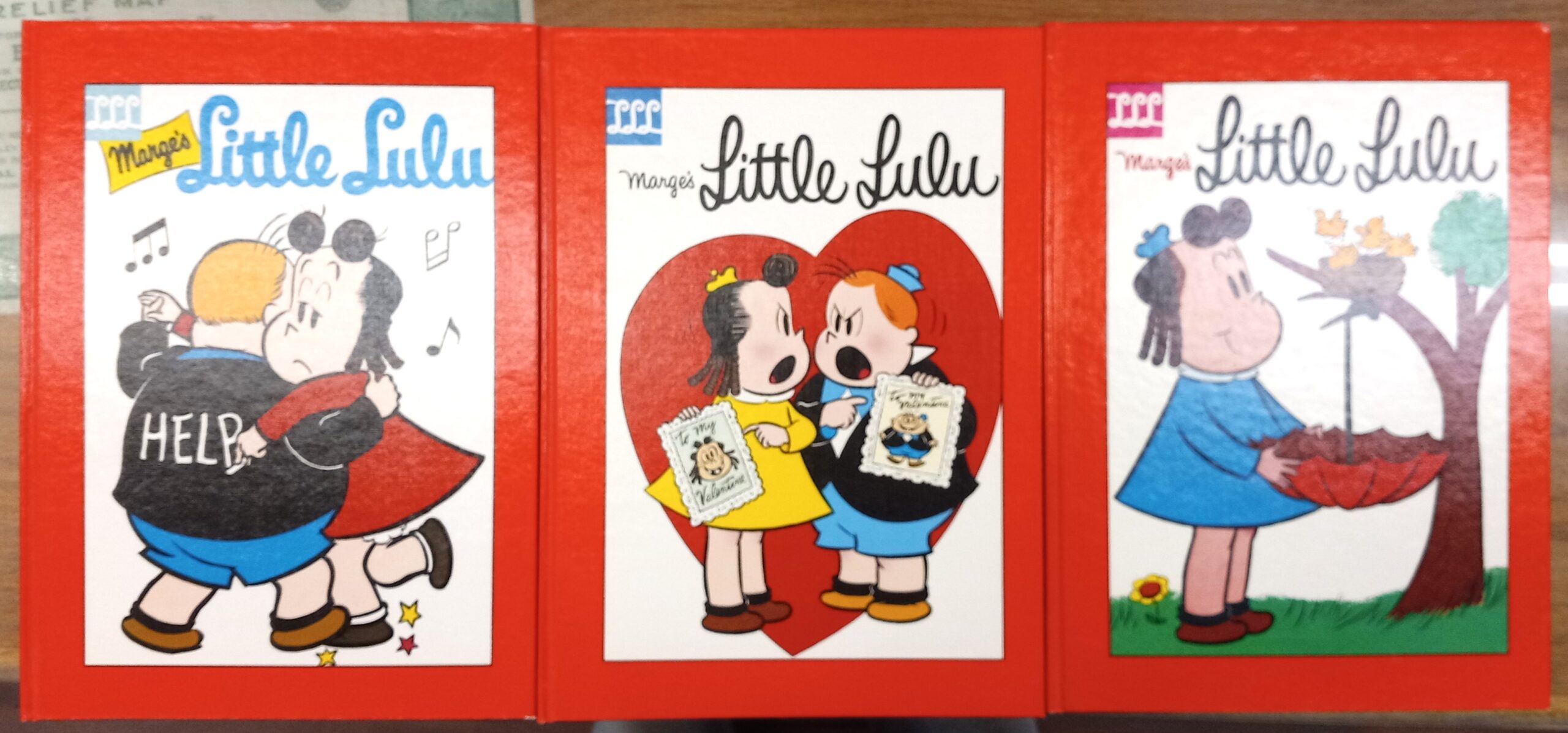 Front covers of all three volumes of The Little Lulu Library 1954-1955