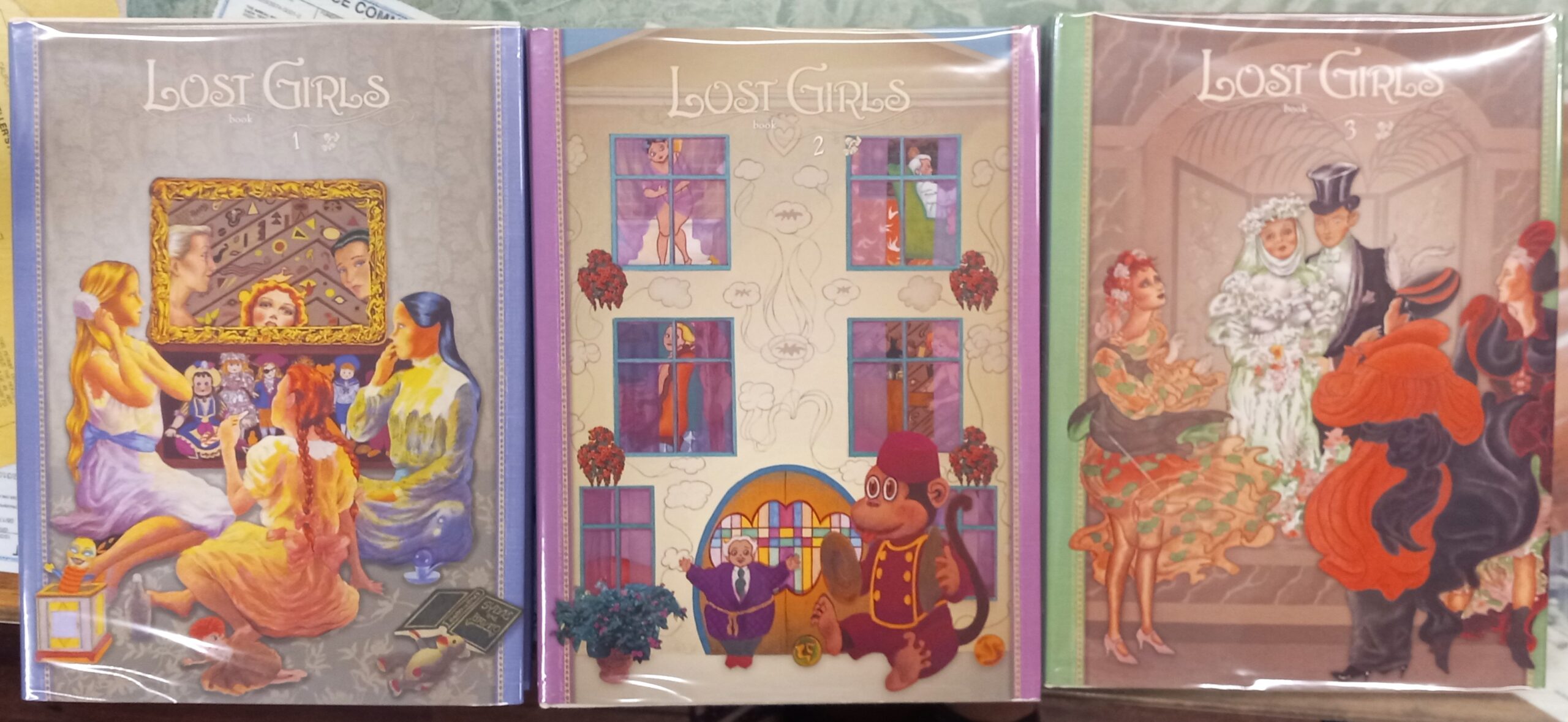 Lost Girls jacket fronts of all three volumes