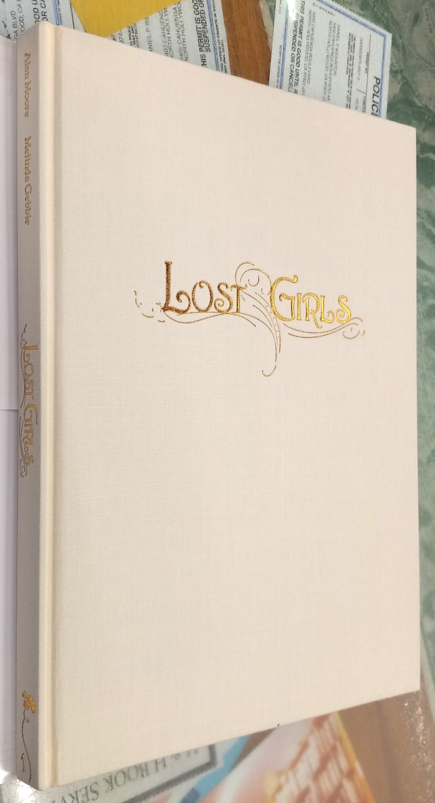Lost Girls binding spine and front board of a single volume