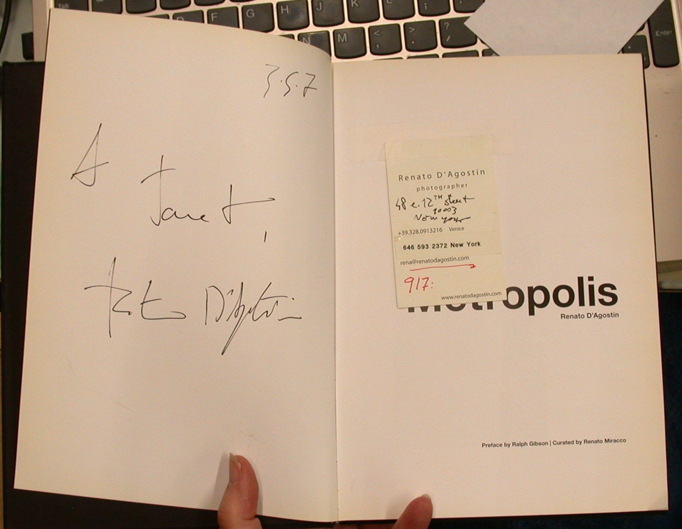 Metropolis title page with author's business card and opposite page with author's inscription and signature
