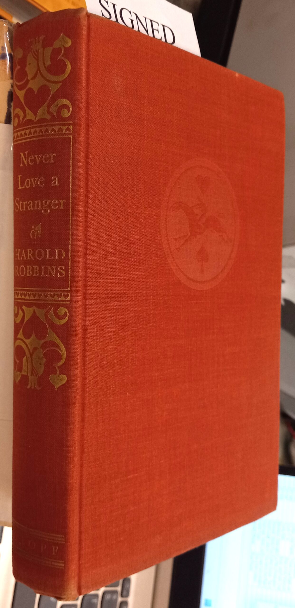 Never Love a Stranger binding spine and front board