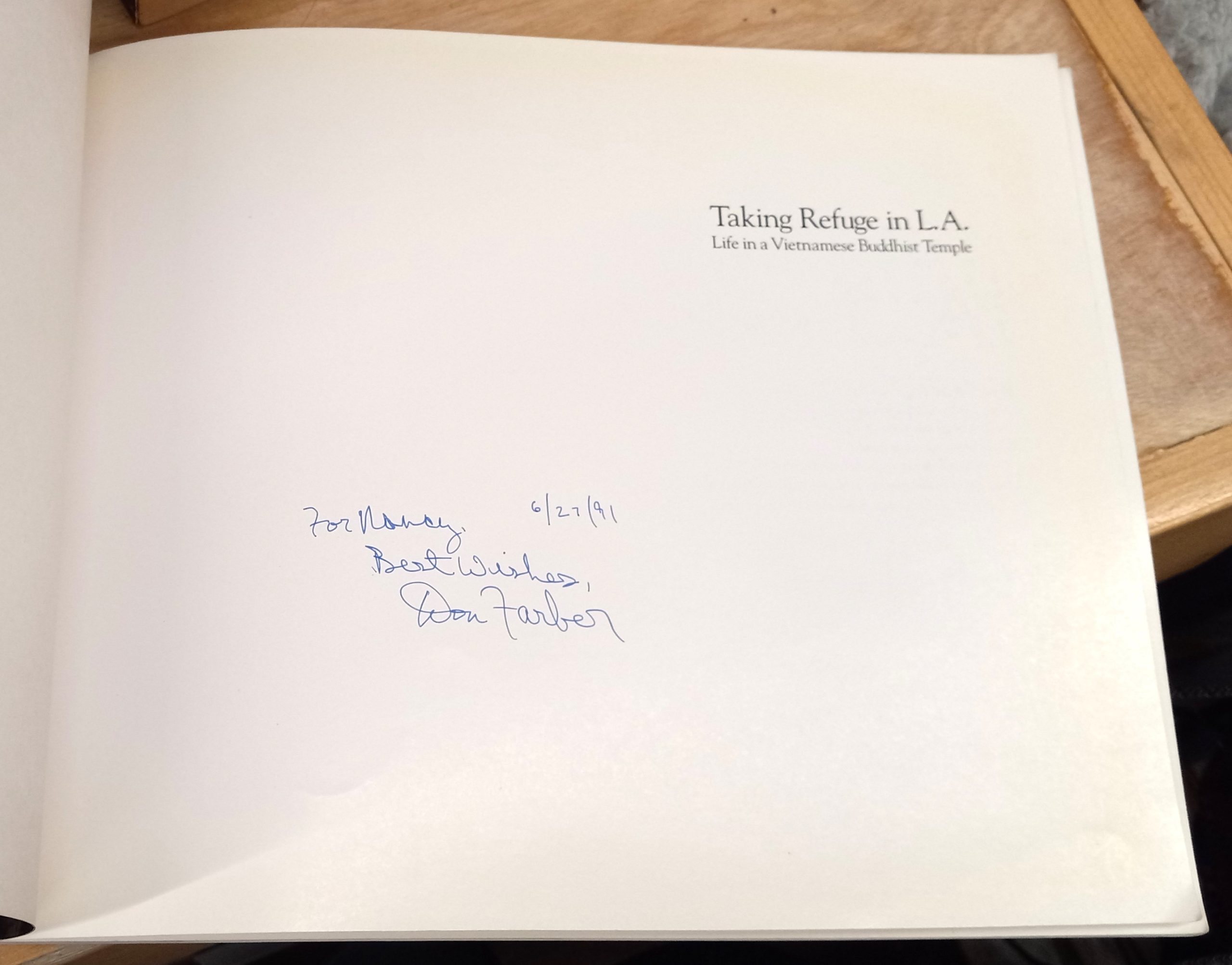 Taking Refuge in L.A. page with author's inscription and signature