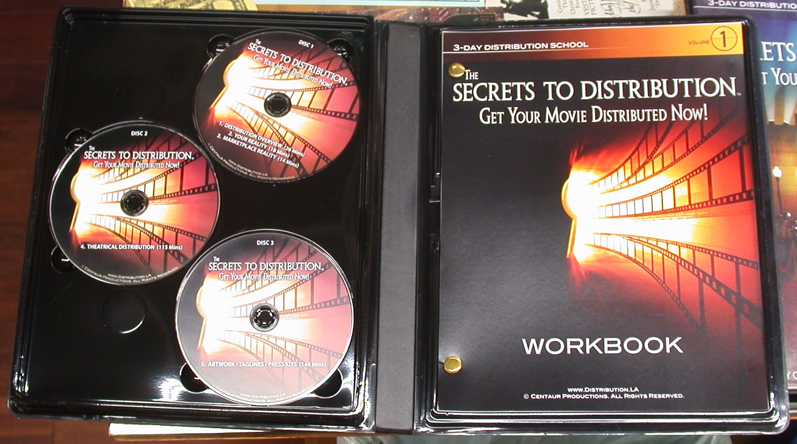 The Secrets to Distribution open case for Volume 1 showing discs and front cover of workbook