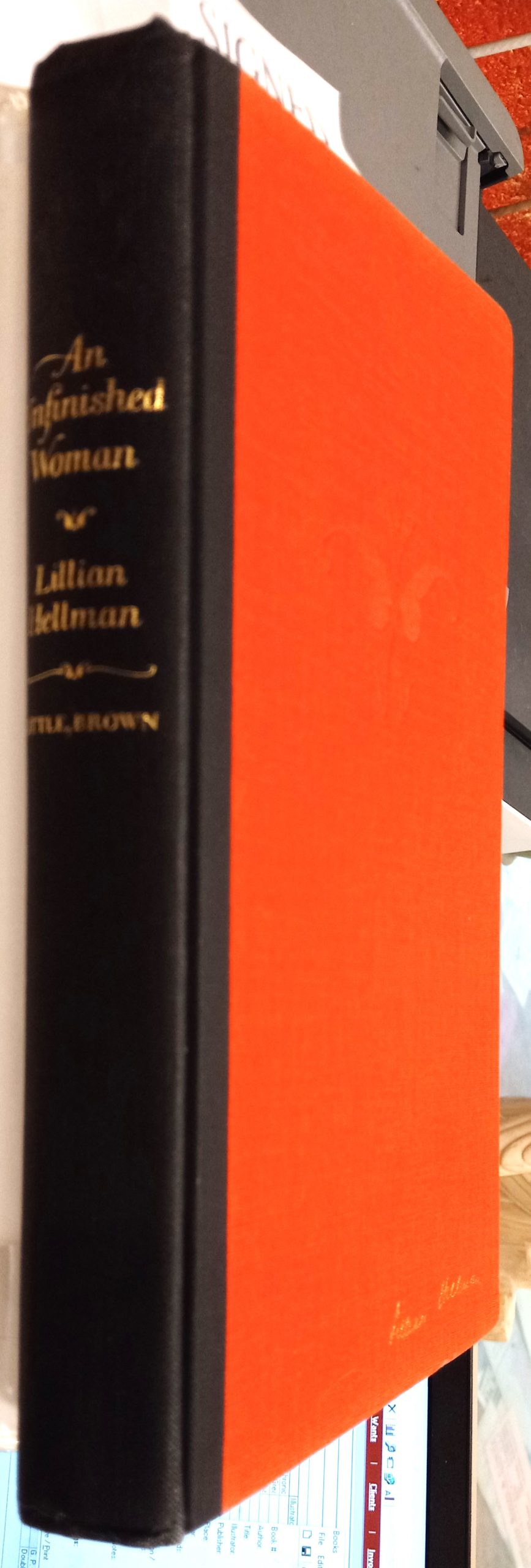 An Unfinished Woman binding spine and front board