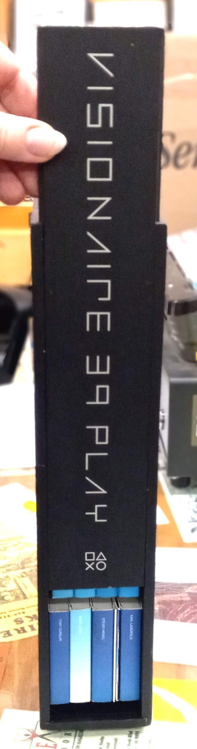 Visionaire 39 spine of box lifted partly up to reveal books inside