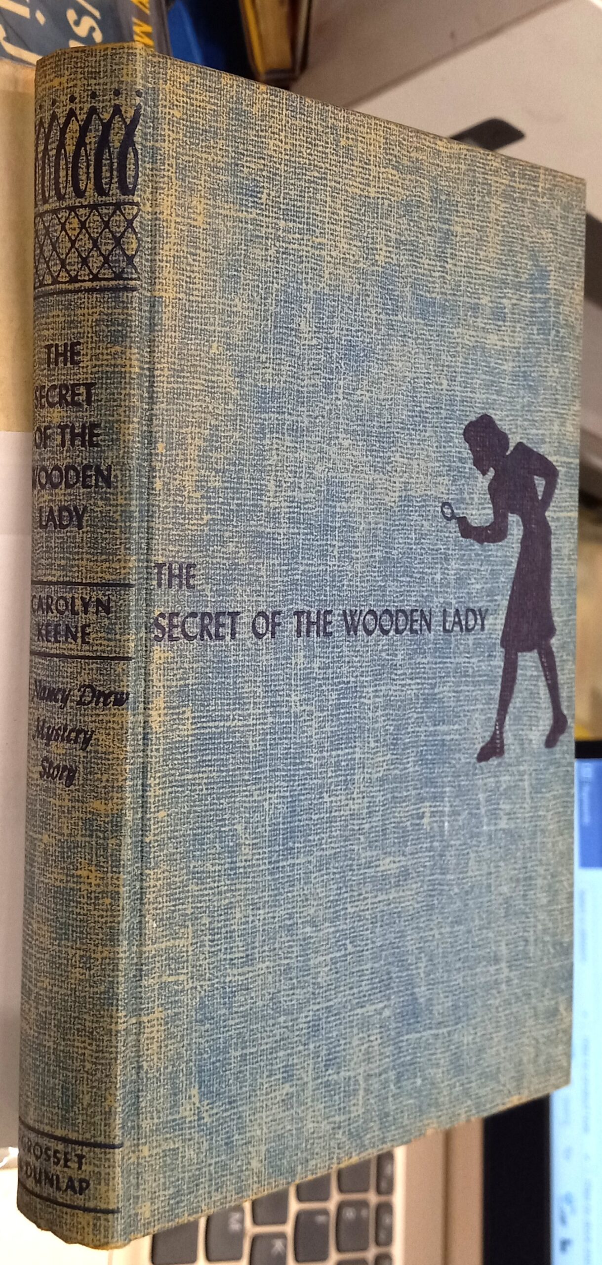 The Secret of the Wooden Lady binding spine and front board